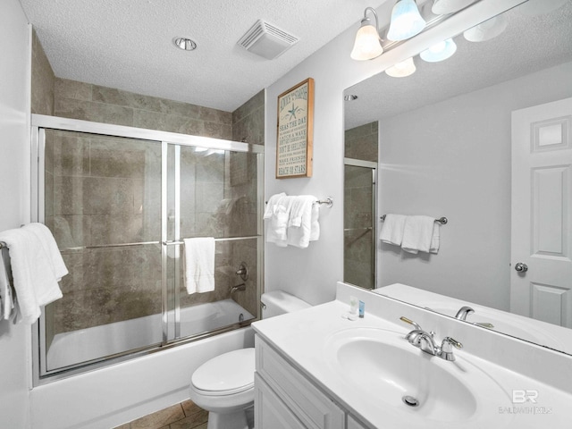 375 Beach Club Trl Unit A1710, Gulf Shores, AL 36542 - full bath with vanity, a textured ceiling, and combined bath / shower with glass door