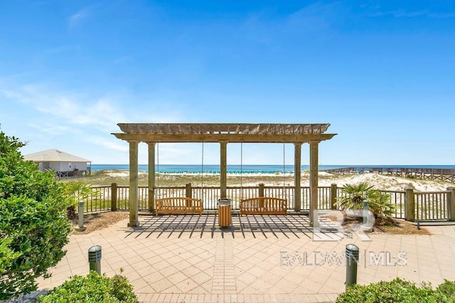 375 Beach Club Trl Unit A1710, Gulf Shores, AL 36542 - view of patio / terrace with a pergola and view of water and beach