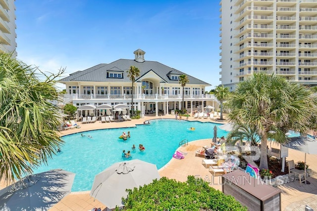 375 Beach Club Trl Unit A1710, Gulf Shores, AL 36542 - community pool with a patio area