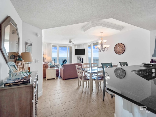 375 Beach Club Trl Unit A1710, Gulf Shores, AL 36542 - kitchen featuring a textured ceiling, a chandelier, light tile patterned floors, pendant lighting, and ceiling fan