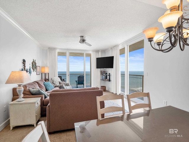 375 Beach Club Trl Unit A1710, Gulf Shores, AL 36542 - living room featuring crown molding, a ceiling fan, a textured ceiling, a chandelier, and expansive windows