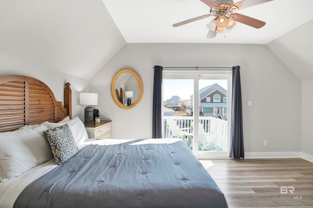 bedroom with access to outside, lofted ceiling, light hardwood / wood-style floors, and ceiling fan