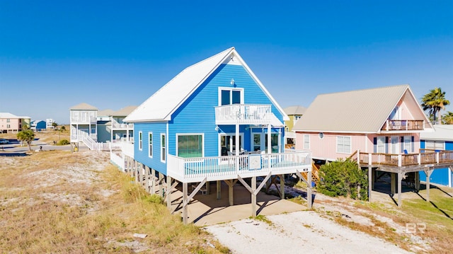 rear view of house featuring a balcony