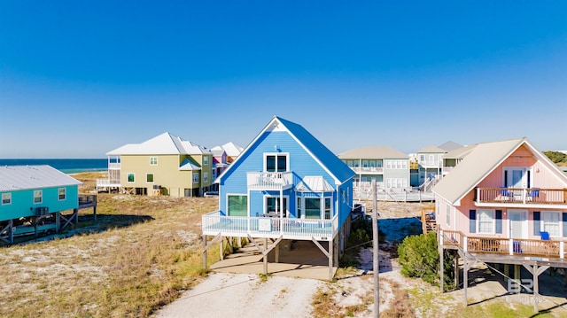 view of front of home with a balcony and a wooden deck