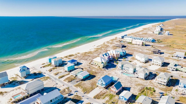 drone / aerial view featuring a view of the beach and a water view