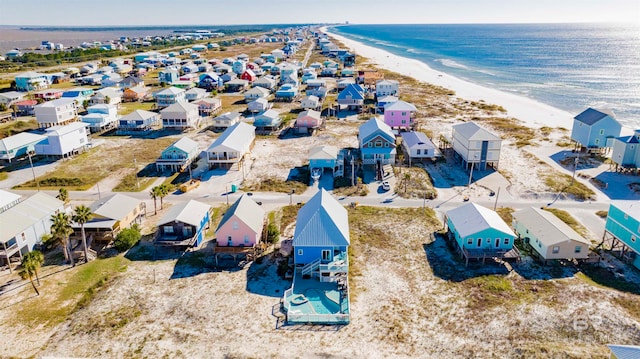 birds eye view of property with a beach view and a water view