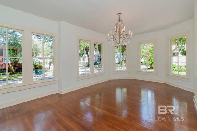 interior space featuring a notable chandelier and dark hardwood / wood-style floors