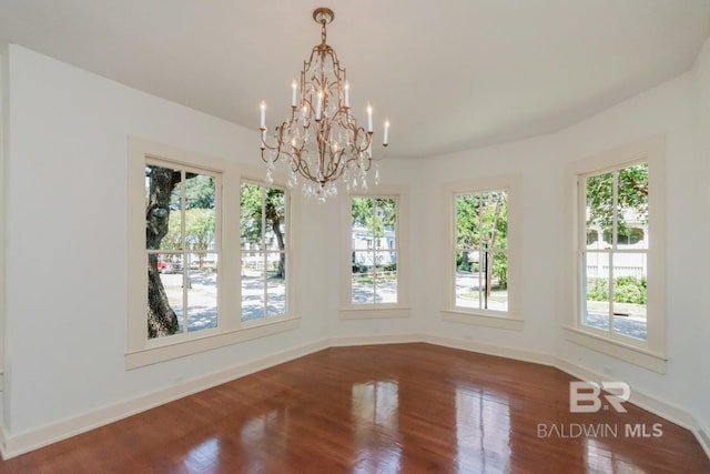 unfurnished dining area with hardwood / wood-style floors