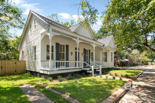 view of front of house featuring a front lawn and a porch