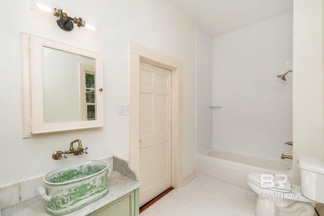 full bathroom featuring sink, bathing tub / shower combination, and toilet