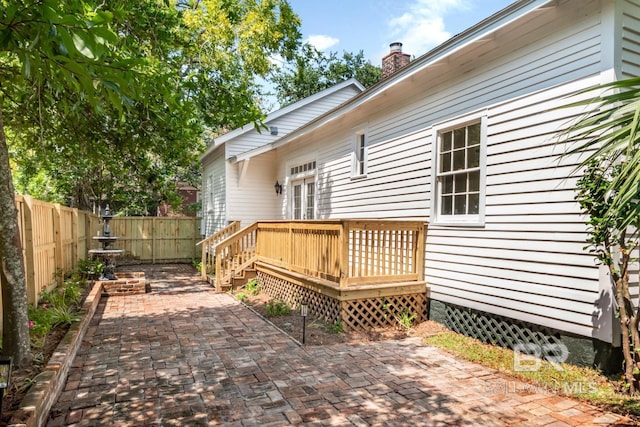 wooden terrace with a patio