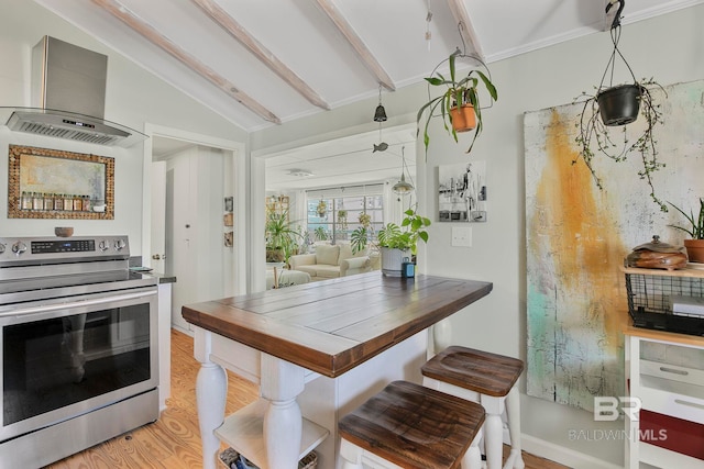 3425 Ponce De Leon Ct, Gulf Shores, AL 36542 - dining area with baseboards, vaulted ceiling with beams, and light wood finished floors