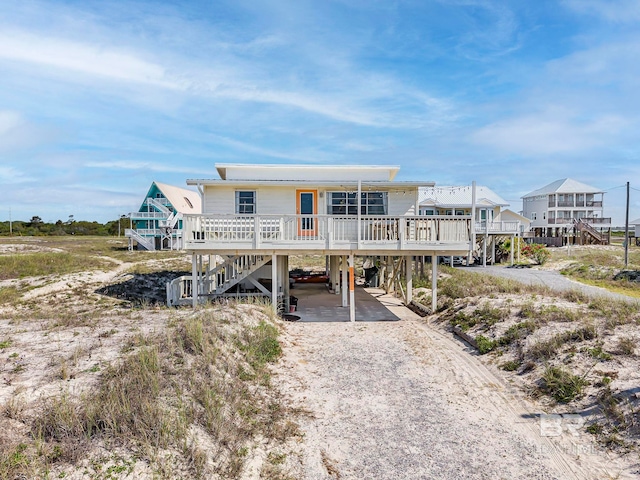 3425 Ponce De Leon Ct, Gulf Shores, AL 36542 - exterior space with driveway, stairs, and a carport