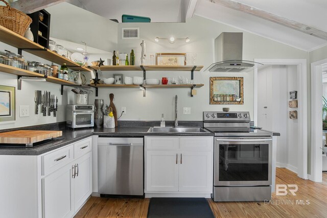 3425 Ponce De Leon Ct, Gulf Shores, AL 36542 - kitchen with wall chimney range hood, open shelves, lofted ceiling with beams, stainless steel appliances, and visible vents
