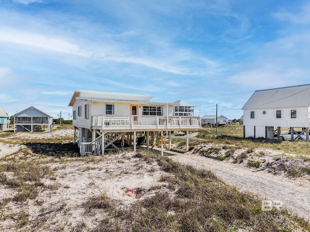 3425 Ponce De Leon Ct, Gulf Shores, AL 36542 - rear view of property featuring a wooden deck and stairs