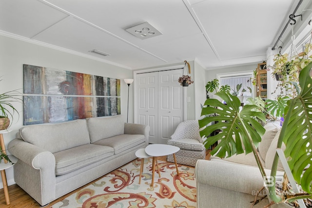 3425 Ponce De Leon Ct, Gulf Shores, AL 36542 - living area featuring crown molding, wood finished floors, and visible vents