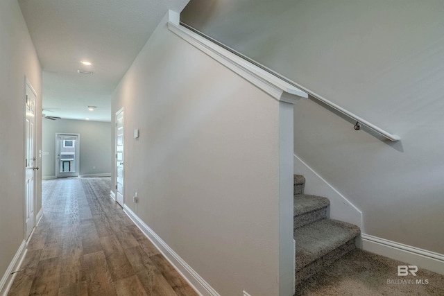 hallway featuring wood-type flooring