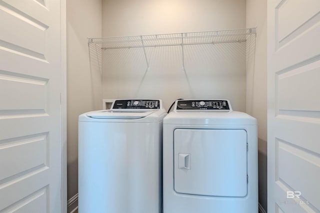 washroom with washer and dryer