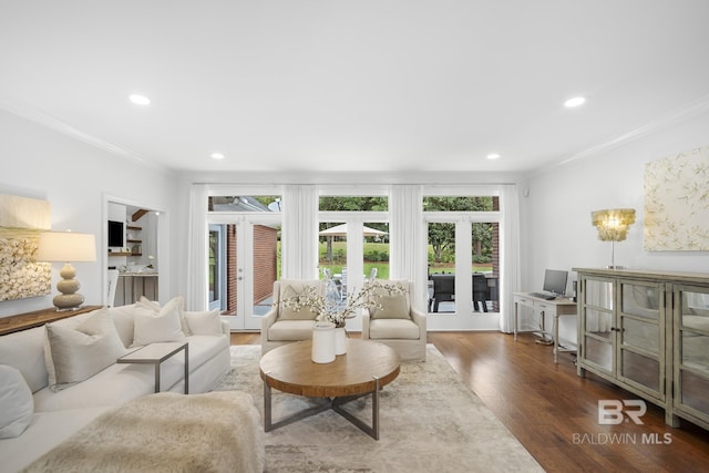 living room with crown molding and dark wood-type flooring