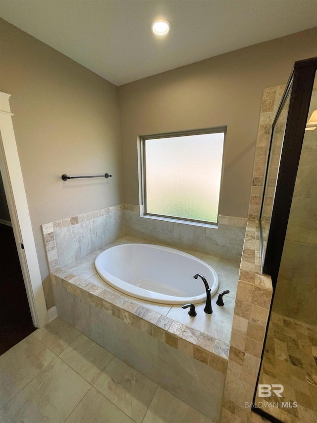 bathroom featuring a garden tub, a tile shower, tile patterned flooring, and recessed lighting