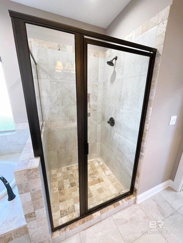 full bath featuring a shower stall