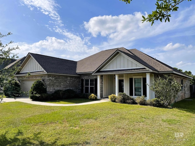 view of front of home with board and batten siding, roof with shingles, a front lawn, brick siding, and a garage