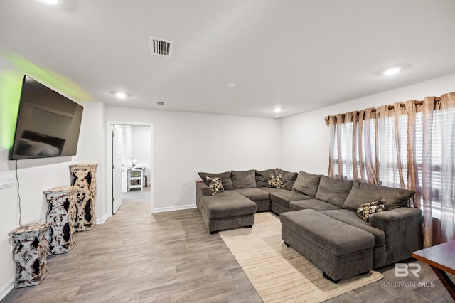 living room with light hardwood / wood-style floors