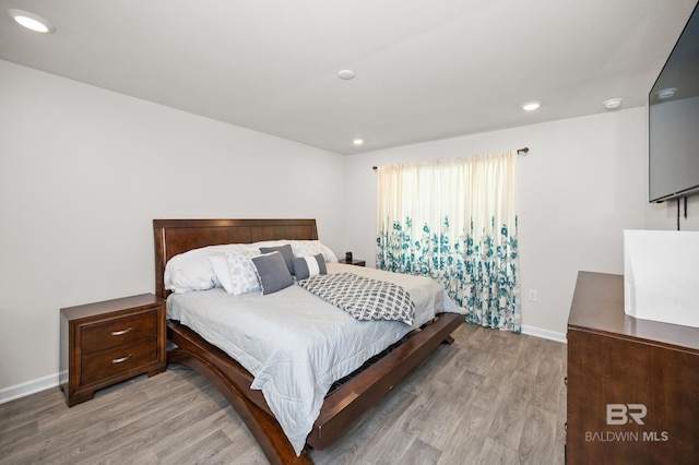 bedroom with light hardwood / wood-style floors