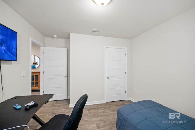 bedroom featuring hardwood / wood-style flooring