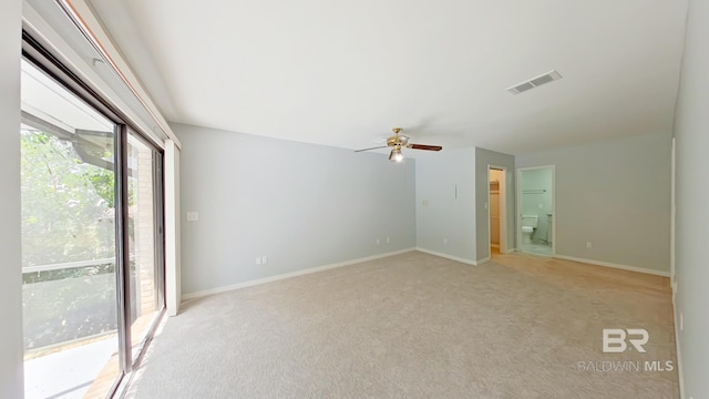 empty room with light colored carpet and ceiling fan