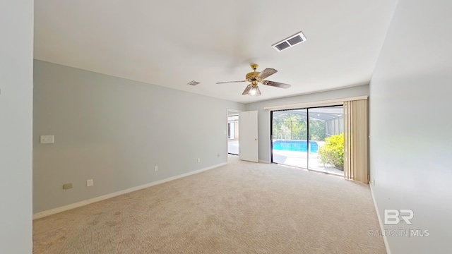 empty room with light colored carpet and ceiling fan