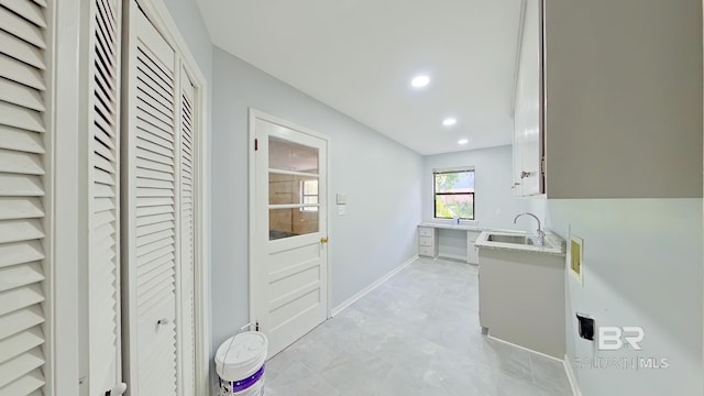 kitchen featuring white cabinets