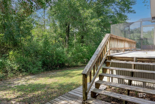 wooden deck with a yard