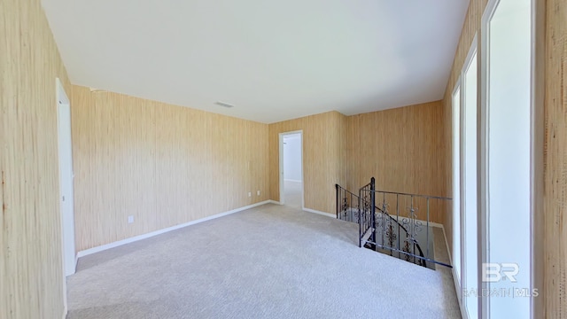 spare room with light colored carpet