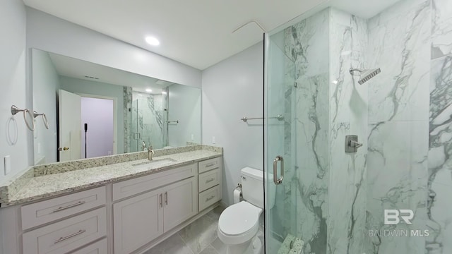 bathroom with toilet, an enclosed shower, and vanity