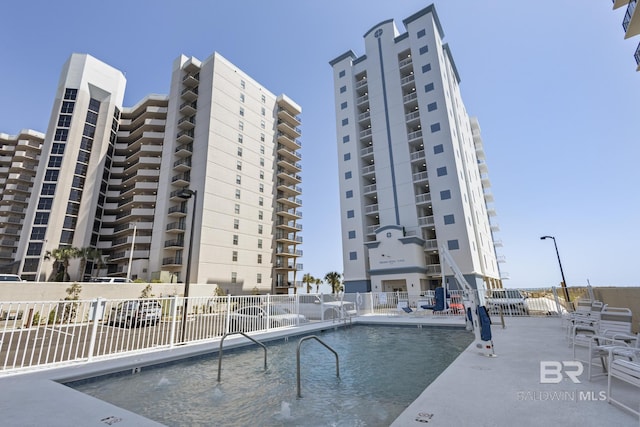 view of swimming pool featuring a patio area