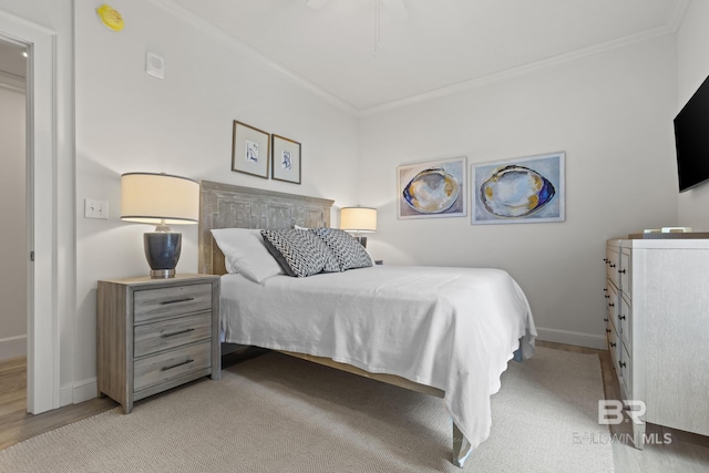 bedroom featuring ceiling fan and crown molding