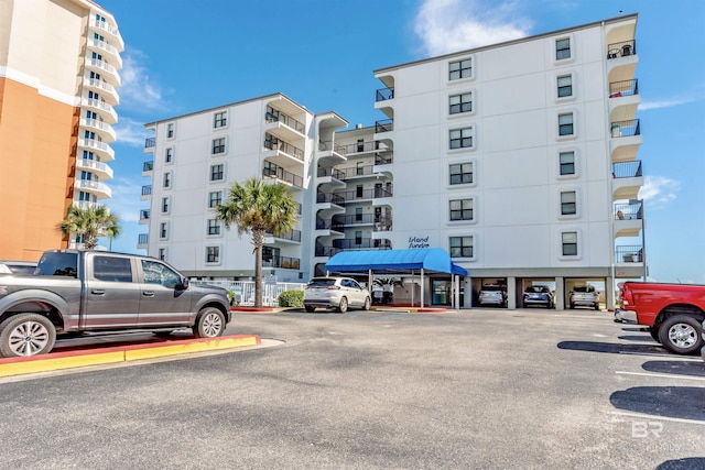 view of property with uncovered parking