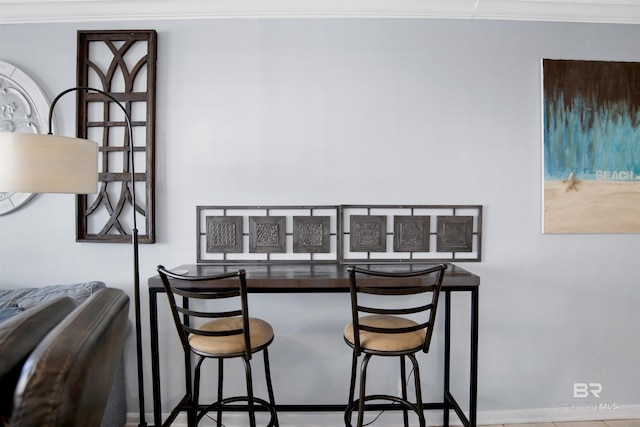 dining area featuring crown molding