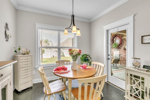 dining area featuring baseboards, ornamental molding, and dark wood finished floors