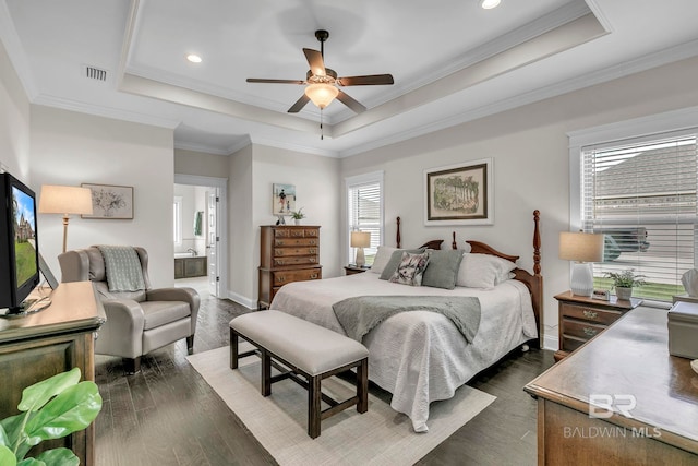bedroom featuring dark wood-style flooring, visible vents, baseboards, a tray ceiling, and recessed lighting