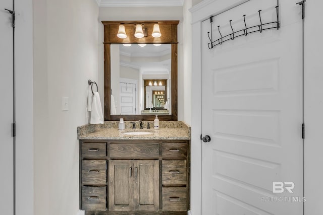 bathroom with crown molding and vanity