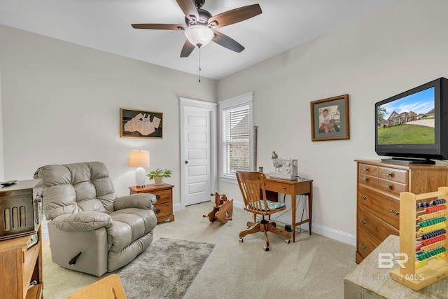 home office with light colored carpet, baseboards, and ceiling fan