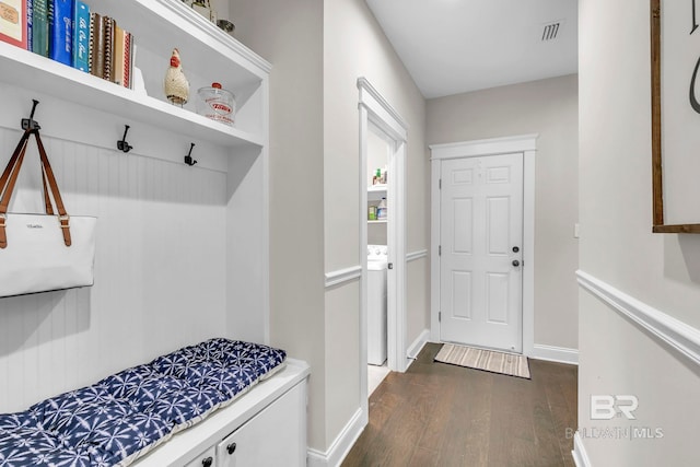 mudroom featuring washer / clothes dryer, baseboards, visible vents, and dark wood-style floors