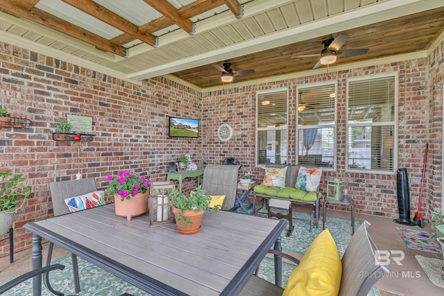 view of patio featuring outdoor dining area and ceiling fan
