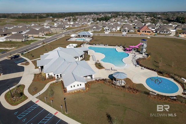 birds eye view of property with a residential view