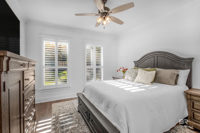 bedroom featuring ceiling fan and dark wood-type flooring