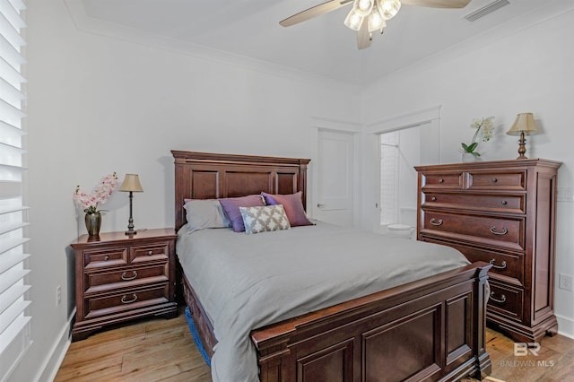 bedroom with ornamental molding, light hardwood / wood-style floors, and ceiling fan