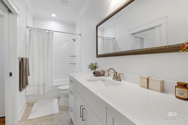 full bathroom featuring shower / tub combo, vanity, and toilet