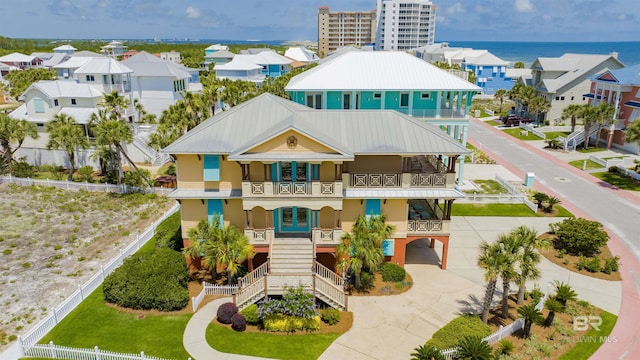 1219 Parasol Pl, Perdido Key, FL 32507 - view of building exterior featuring driveway, stairway, an attached garage, and a residential view